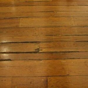 warped hardwood floorboards from high humidity in the home